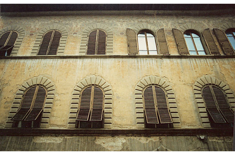 Before: the barely legible condition of the painted façade by Galileo Chini (1904-05), 15th century building.<br />Via Cavour 18-24, Arezzo, Italy.